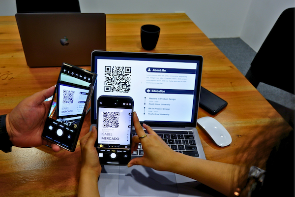 QR code CV being scanned on mobile devices, showing a living breathing CV